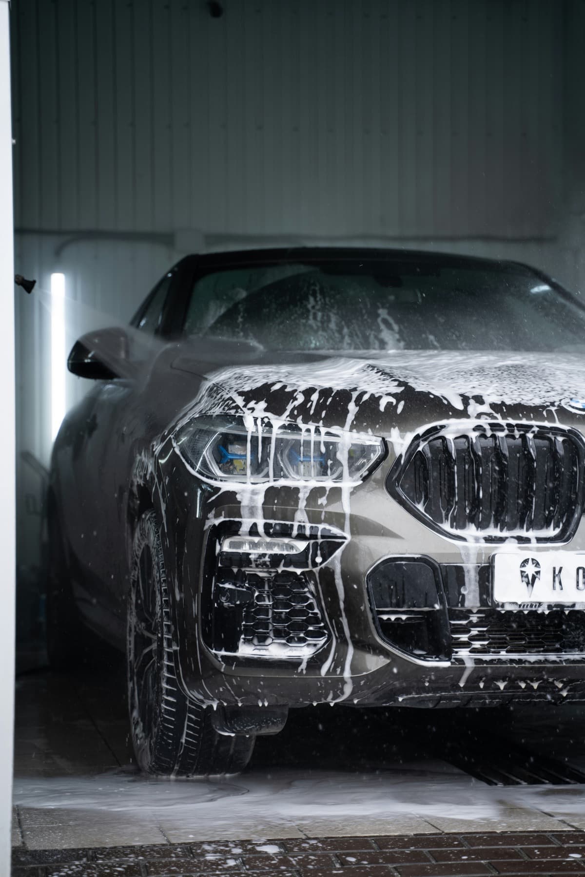 Mobile detailing foam wash on a vehicle